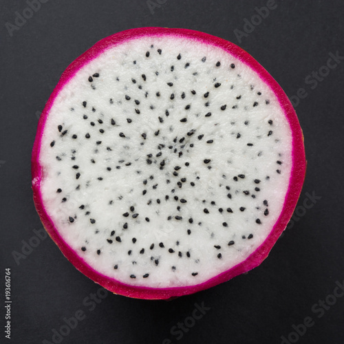 Isolated tropical pitaya, dragon fruit on black. Close up. top view.