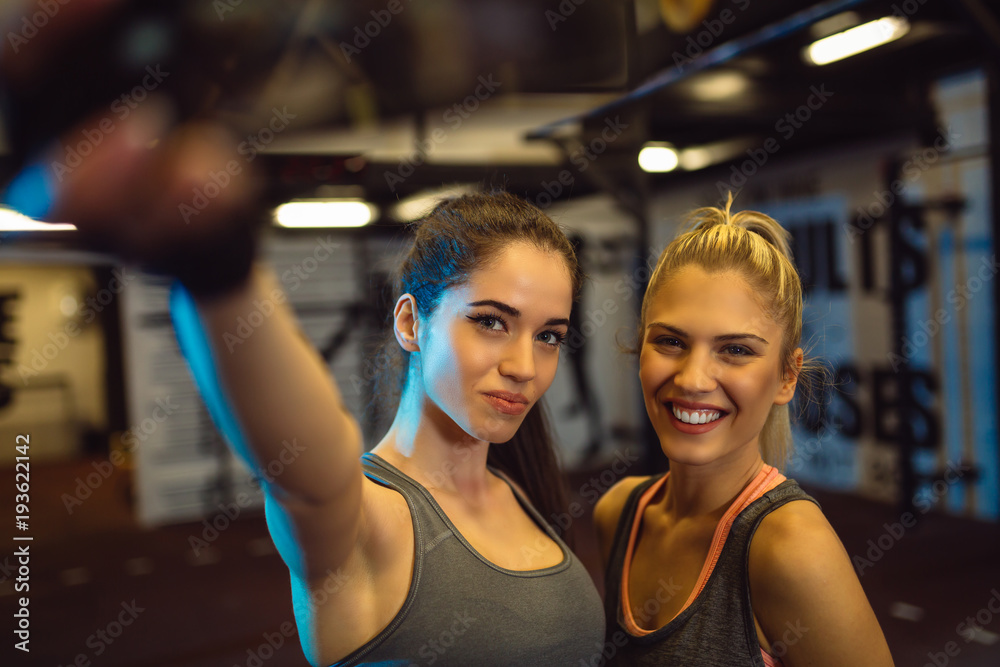 Friends having fun at the gym. Making a selfie photo. Friends having fun at the gym. Making a selfie photo.