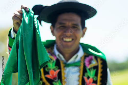 Portrait of a man dancing Huayno, a traditional musical genre typical of the Andean region of Peru, Bolivia, northern Argentina and northern Chile