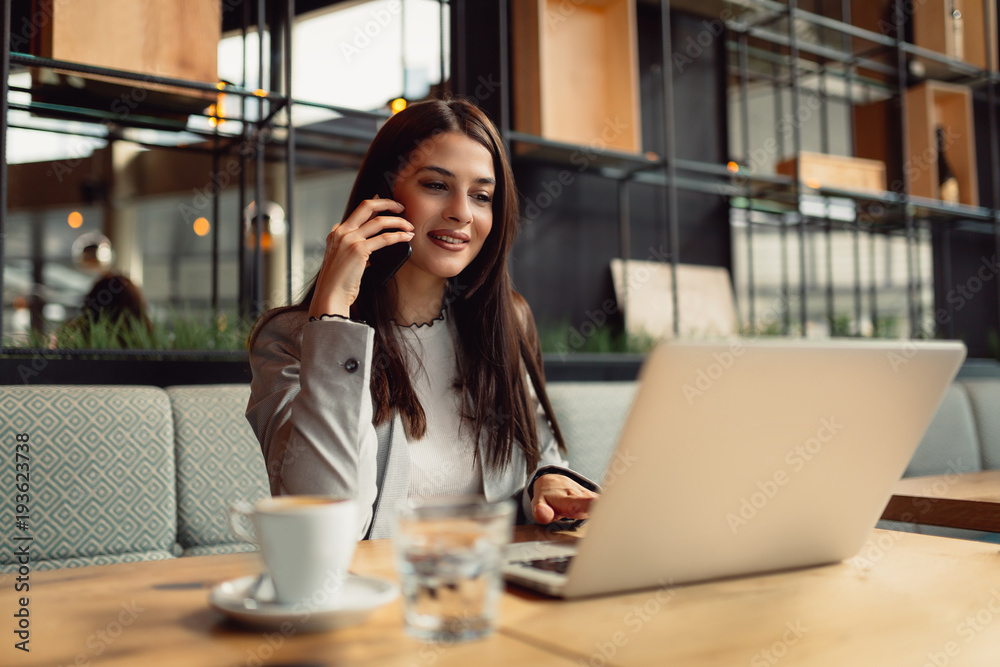 Businesswoman using technologies.