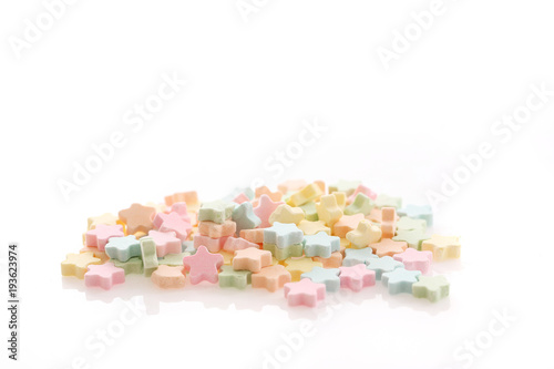 Colourful Star Milk pellets isolated in white background