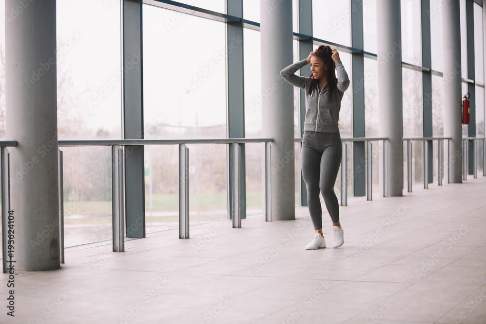 Young attractive girl running indoors. Young attractive girl running indoors.