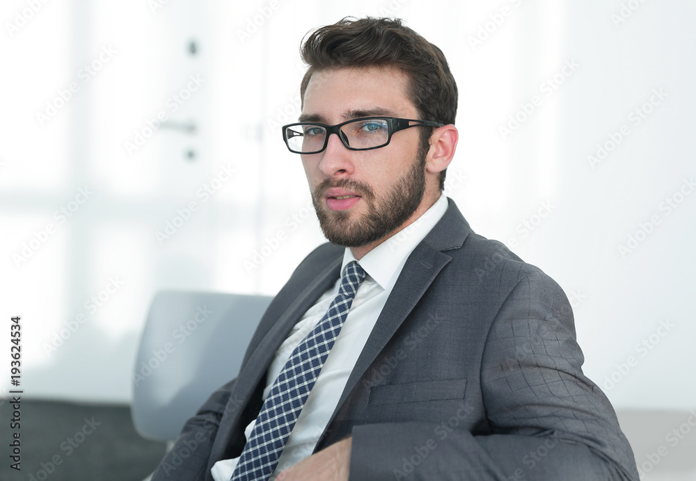 closeup.confident businessman sitting in a chair closeup.confident businessman sitting in a chair