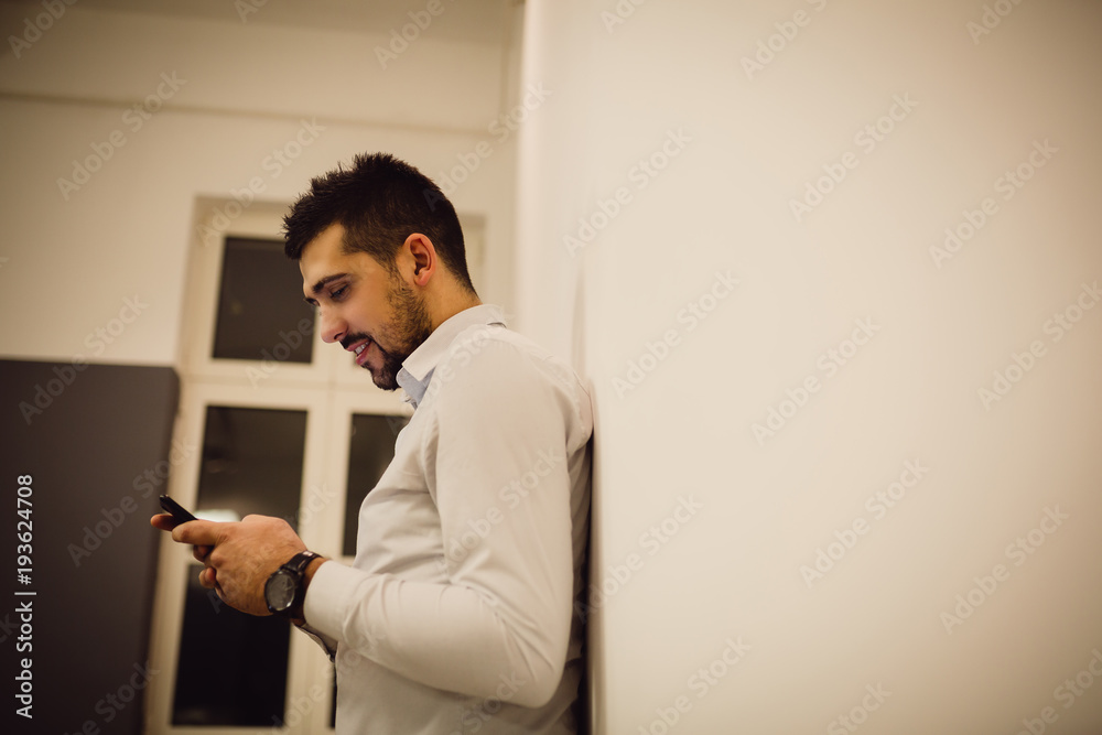 Handsome businessman using mobile phone. Handsome businessman using mobile phone.