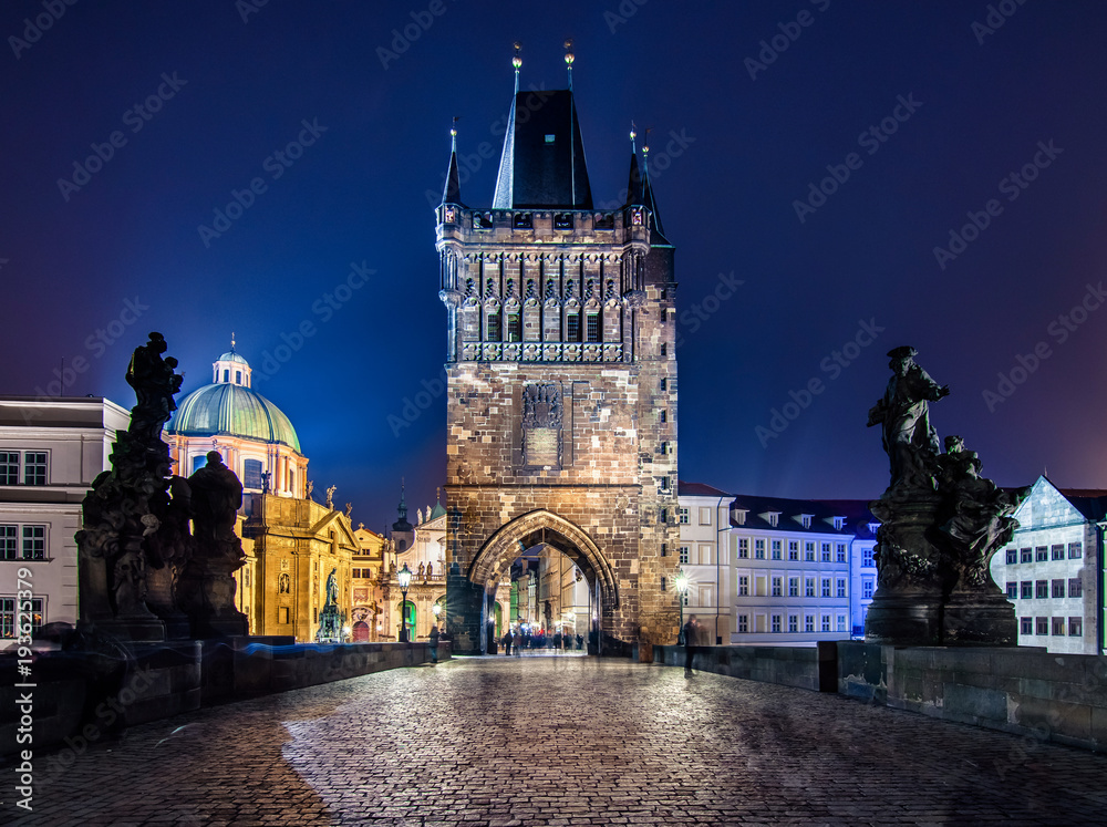 Naklejka premium Famous Charles Bridge and tower at night, Prague, Czech Republic