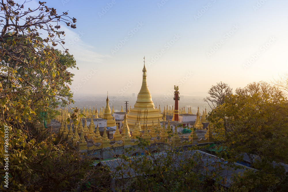 The golden pagoda with Mandalay cityscapes in the background, Myanmar  