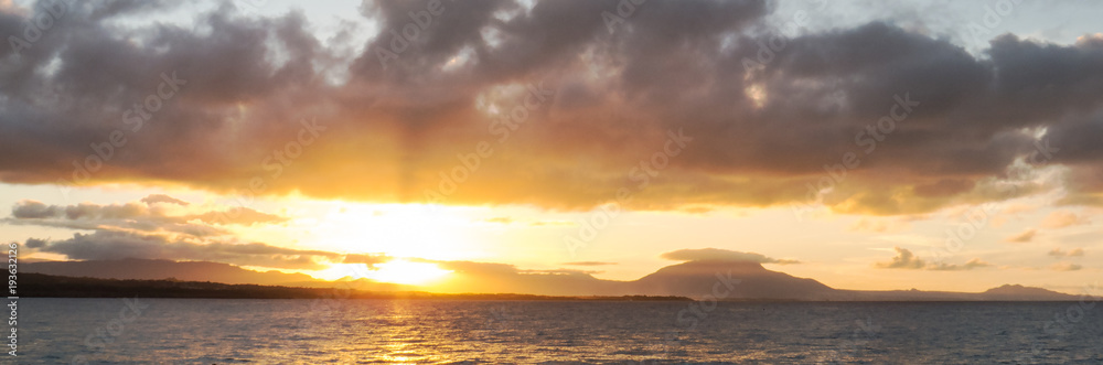 A bright panoramic sunset over the Dominican nature ,mounts, and hills. The photo was taken from Sosùa.