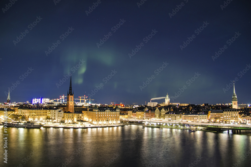 Night panorama with northern lights of Gamla Stan (Old Town), Stockholm , Sweden 