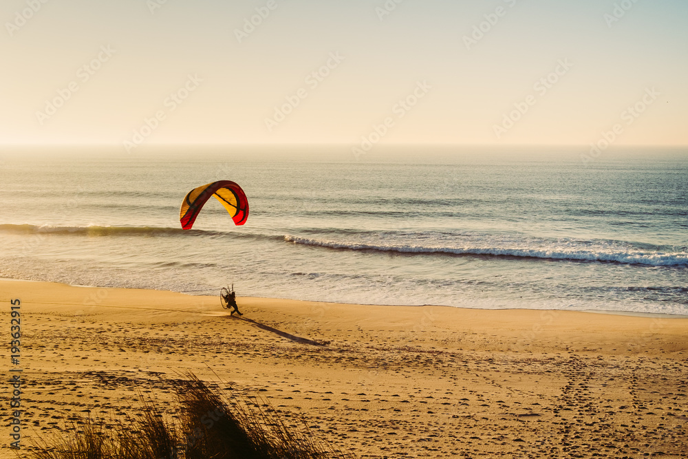 Doing some Paragliding on a beach