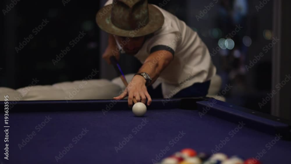 Man shoots first shot in a game of pool