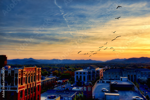 Asheville North Carolina at sunset with the Blue Ridge Mountains in the distance. photo