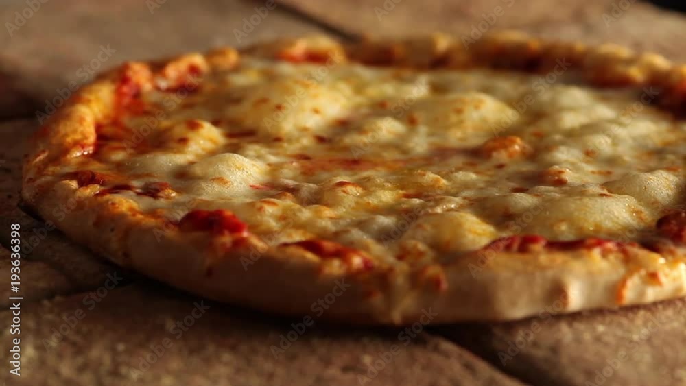 Cheese on pizza bubbling in oven