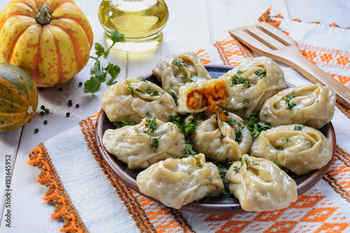 Delicious, mouth-watering dish of South Caucasian, Central Asian cuisine - Manti filled with pumpkin