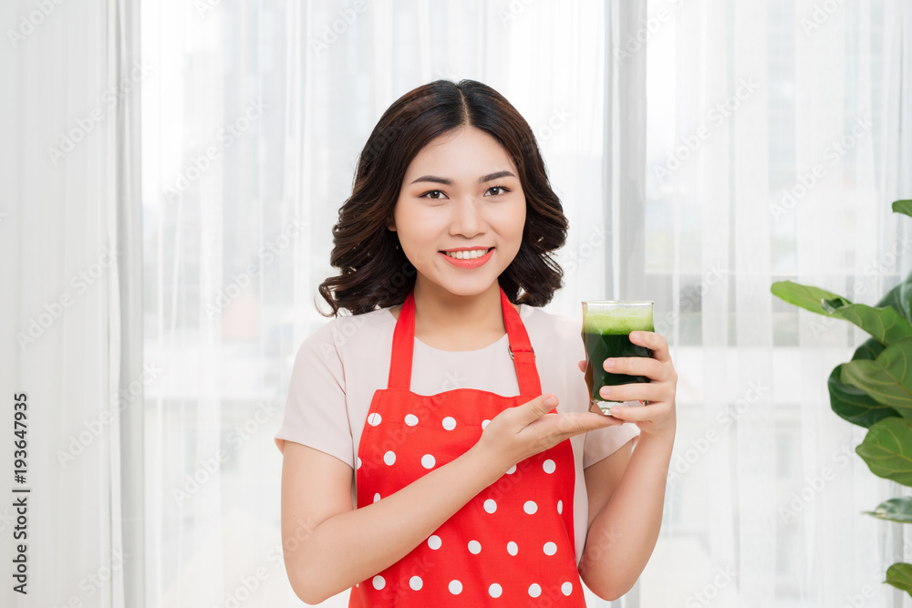 Young asian woman enjoy healthy vegetarian smoothie for weight loss and detox