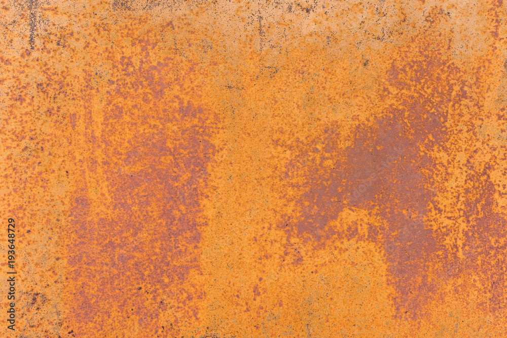 Textured background of a faded yellow paint with rusted cracks on rusted metal. Grunge texture of an old cracked metal surface. Rusty yellow-red stains Textured background of a faded yellow paint with rusted cracks on rusted metal. Grunge texture of an old cracked metal surface. Rusty yellow-red stains