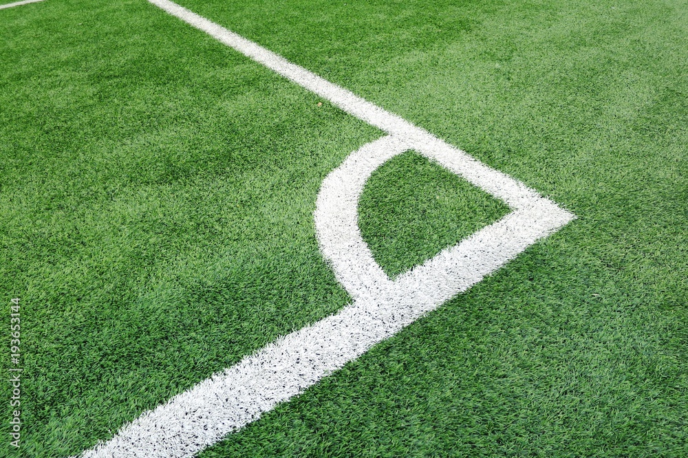 Corner Soccer field or football field texture background. White lines on green grass. Sport background concept.