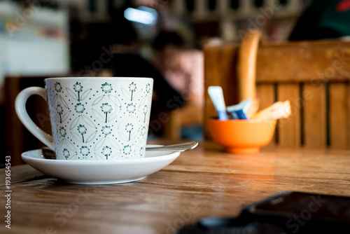Coffee cup on the table with soft light