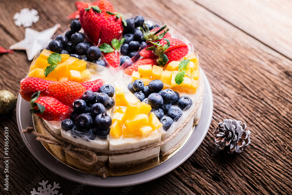 delicious mix fruit cake on wooden table