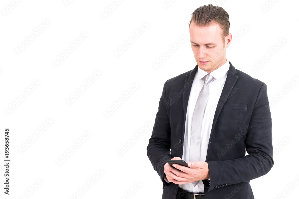 Businessman in elegant black suit using smartphone isolated on white background Businessman in elegant black suit using smartphone isolated on white background