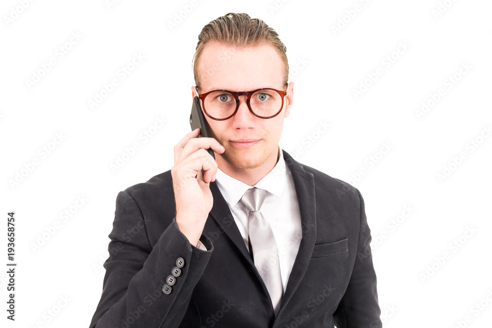 Businessman in elegant black suit using smartphone isolated on white background Businessman in elegant black suit using smartphone isolated on white background