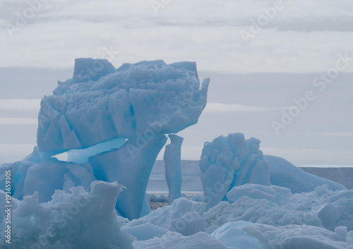Canvas Print Close Up of an Antarctic Sound Iceberg with blue color and ice stacked in haphazard fashion