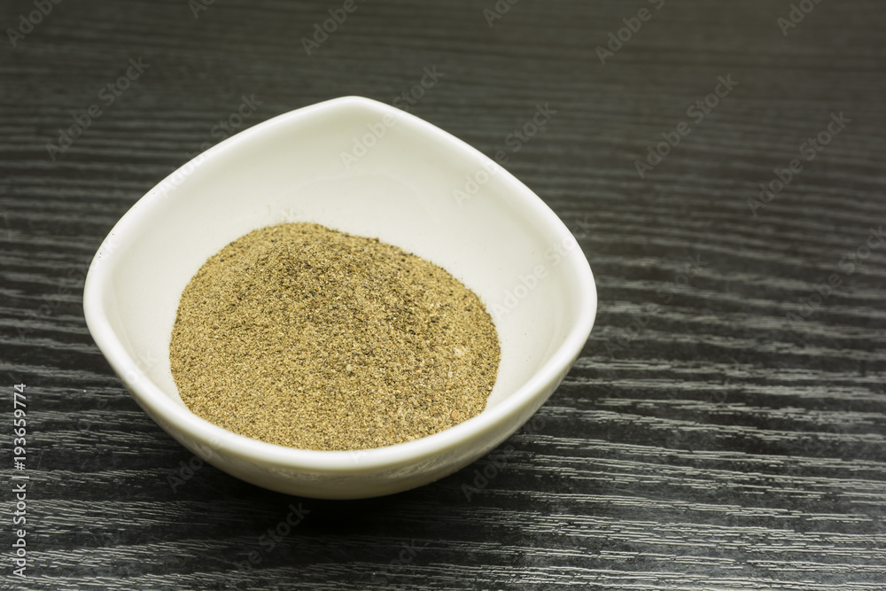 Ground black pepper in a bowl. Ground black pepper in a bowl.