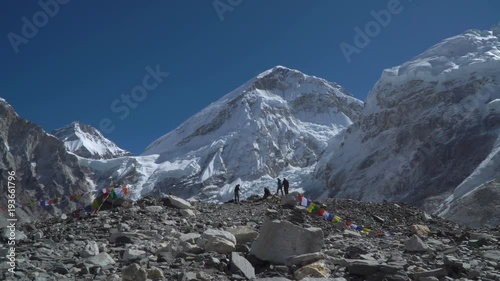 Tourists against the background of Mount Everest. the base camp of Everest. Everest is the highest mountain in the world. 4K