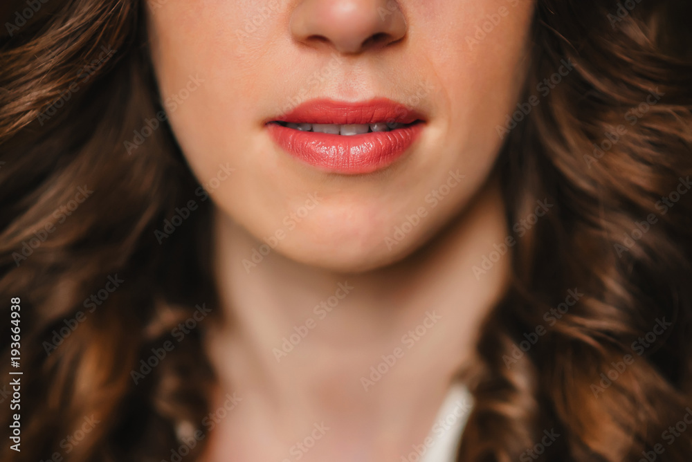peaked attractive girl lips with red lipstick close up peaked attractive girl lips with red lipstick close up