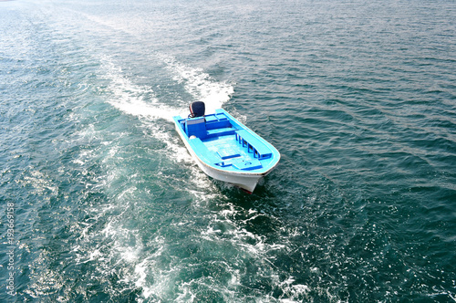 motor boat sails on the waves of the Gulf of Oman