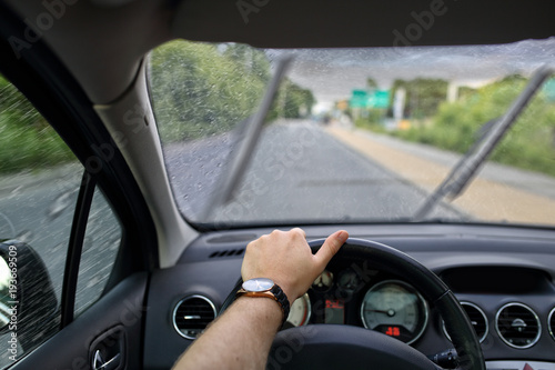 Driving a car on a gray and cloudy rainy day