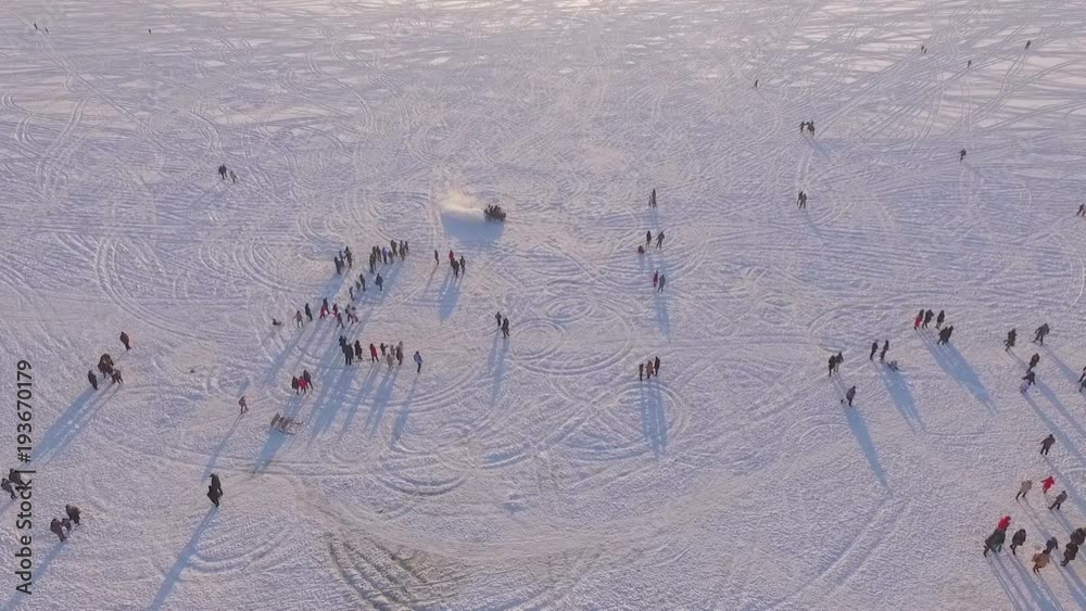 aerial view. Winter vacation on the frozen lake. Snowmobile, horses. Winter sports. Winter fun. Ternopil Ukraine aerial view. Winter vacation on the frozen lake. Snowmobile, horses. Winter sports. Winter fun. Ternopil Ukraine