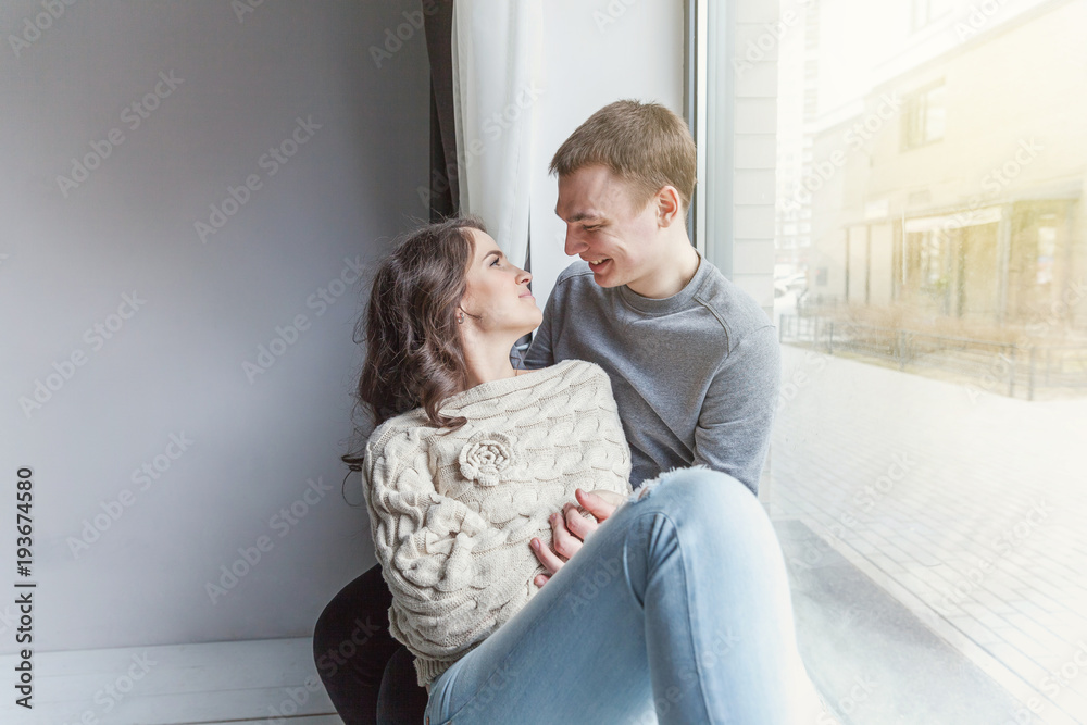 Couple in love having nice time together. Young happy woman hugging her handsome boyfriend. Cheerful casual people students having hopes, dreams, goals, bride and groom with family wants and aspiratio Couple in love having nice time together. Young happy woman hugging her handsome boyfriend. Cheerful casual people students having hopes, dreams, goals, bride and groom with family wants and aspiratio