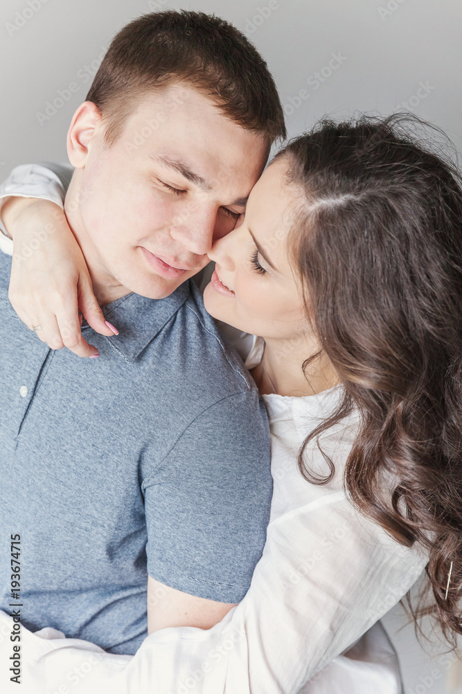 Couple in love having nice time together. Young happy woman hugging her handsome boyfriend. Cheerful casual people students having hopes, dreams, goals, bride and groom with family wants and aspiratio Couple in love having nice time together. Young happy woman hugging her handsome boyfriend. Cheerful casual people students having hopes, dreams, goals, bride and groom with family wants and aspiratio