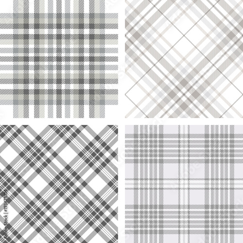 Set of four seamless tartan plaid patterns in shades of grey and white. Traditional checkered fabric textures.  
