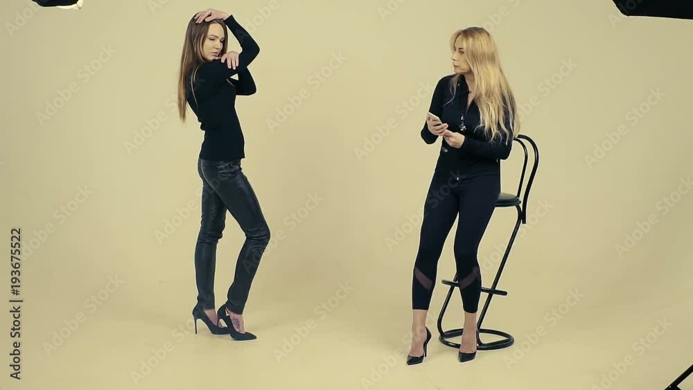 Young beautiful female model in black posing for photo shoot in a ...