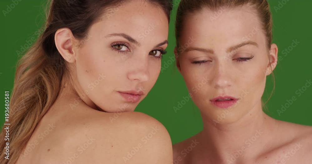 Attractive young models posing in make-up on green screen Attractive young models posing in make-up on green screen