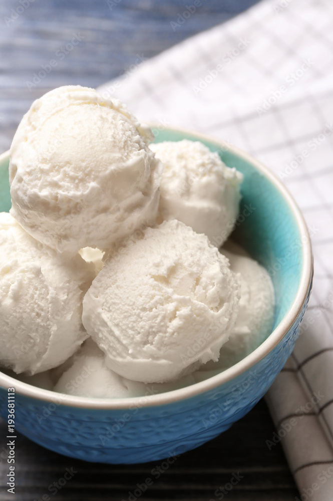Bowl with delicious vanilla ice cream, closeup
