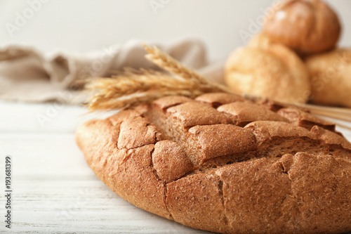 Freshly baked loaf of bread on table