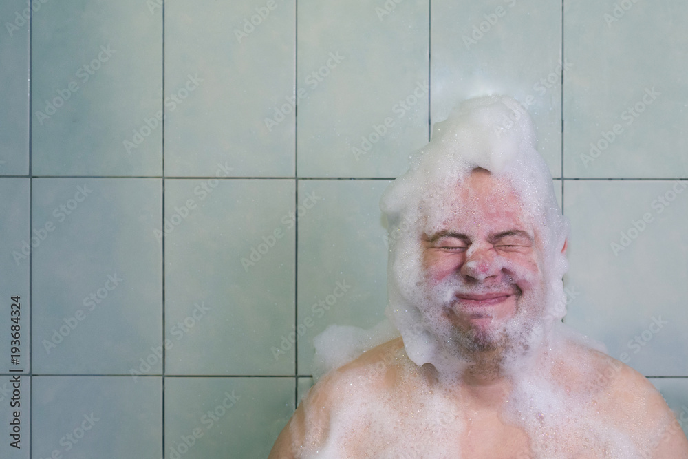 guy washes his head in foam guy washes his head in foam