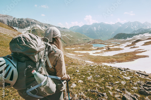 Backpacker tourist hiking in mountains adventure travel lifestyle concept active summer vacations sport outdoor