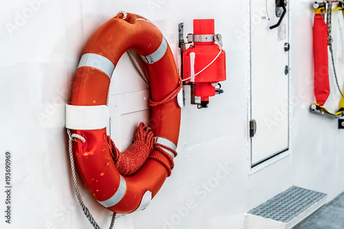Lifebuoy is fixed on hull of a ship. Side view.