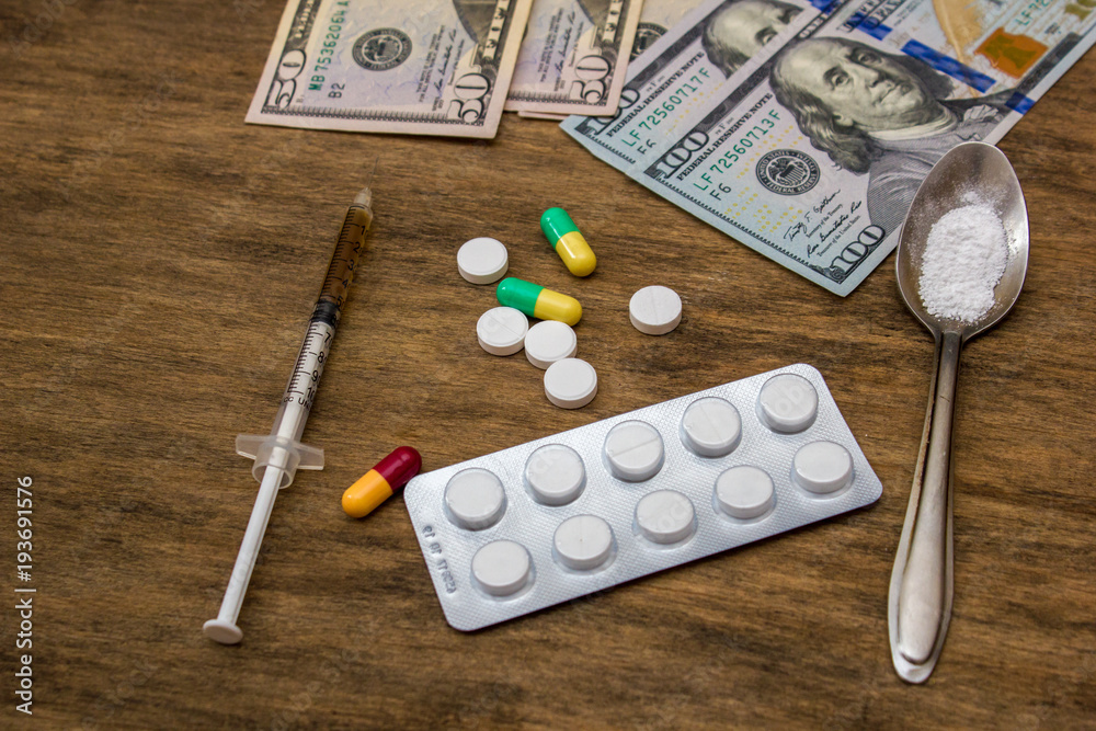 drugs and money on the table drugs and money on the table