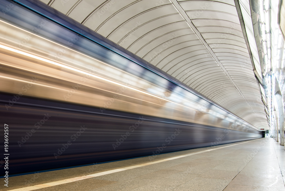 Subway metro train arriving at a station