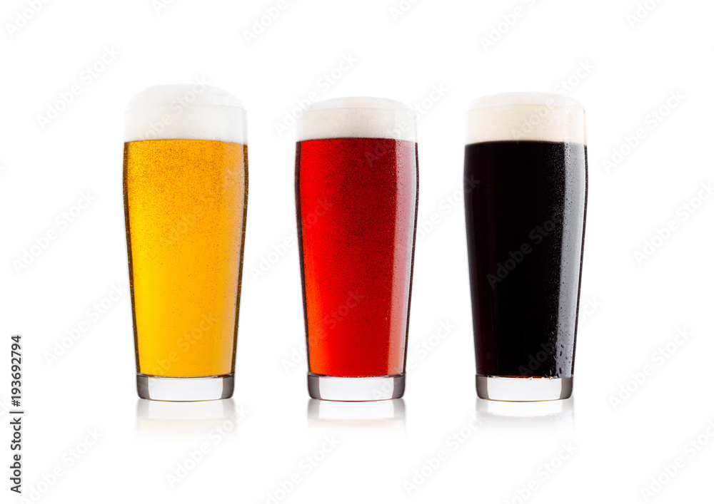Cold glasses of lager stout and red beer with dew Cold glasses of lager stout and red beer with dew