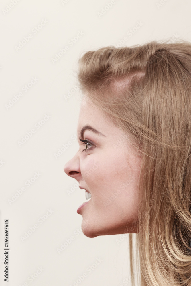 Angry furious woman screaming, profile view. Angry furious woman screaming, profile view.