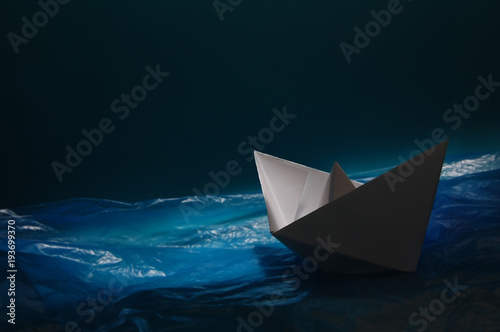 Paper boat in the Plastic Sea