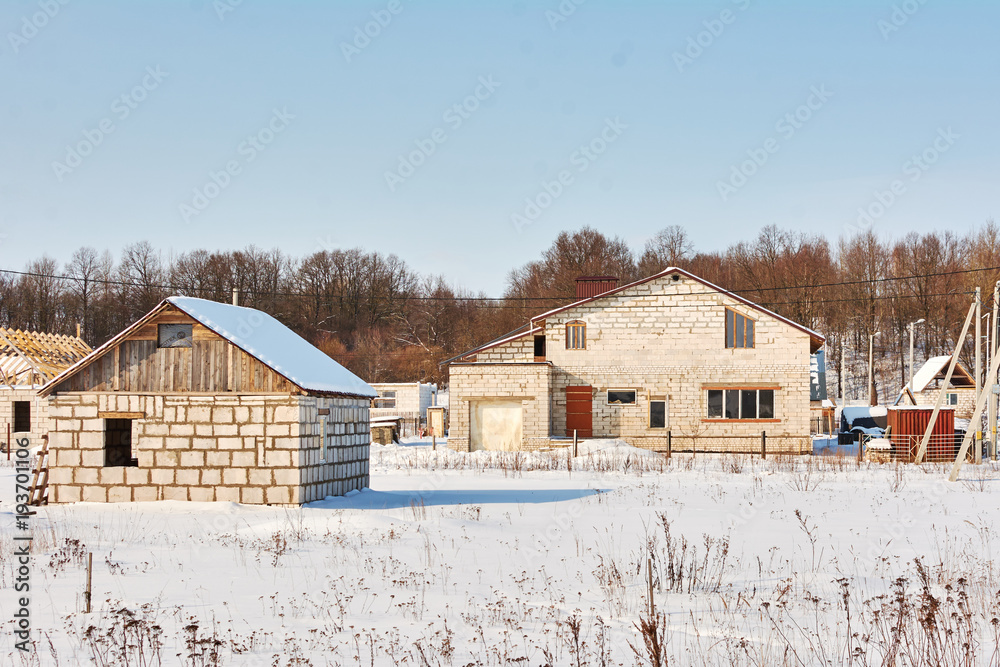 being built from limestone blocks house on the winter background being built from limestone blocks house on the winter background