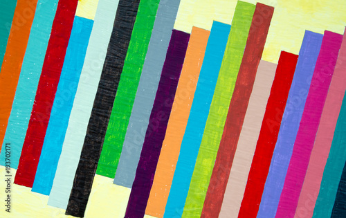 Colorful painted stripes on pale yellow background