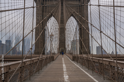 Brooklyn Bridge and New York City Manhattan skyline on the background on moody morning © TetyanaOhare