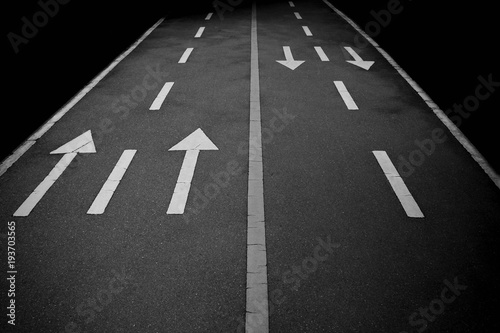 Forward arrow signs on the road